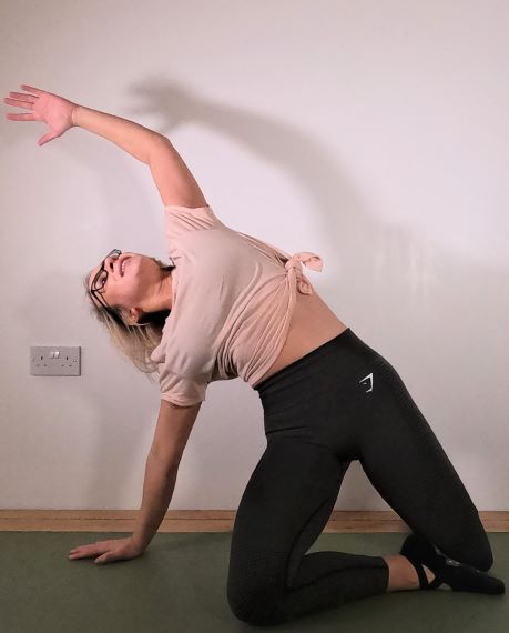 Pilates instructor demonstrating pilates exercise