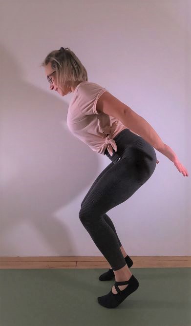 Pilates Instructor demonstrating Pilates exercise